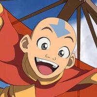 Aang volando sonriente con su planeador