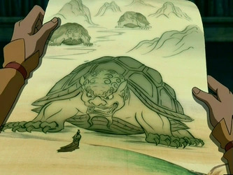 Las manos de Aang sosteniendo un dibujo de un león tortuga